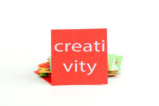 picture of a red note paper with text creativity