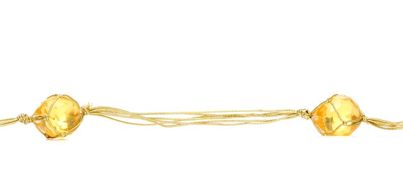 picture of a necklace with cheap plastic gems with golden colored rope
