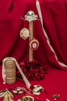 handmade Christmas decorations and toys on a red background