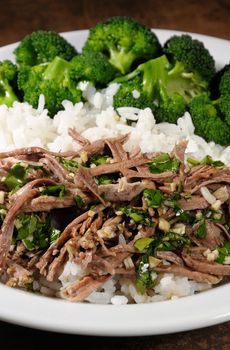 boiled beef with pungent spokes sauce garnish rice with broccoli