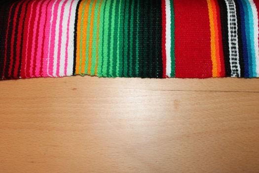 Mexico traditional cinco de mayo rug poncho fiesta background with stripes copy space