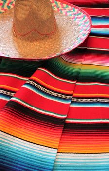 Mexico traditional cinco de mayo rug poncho fiesta background with stripes copy space