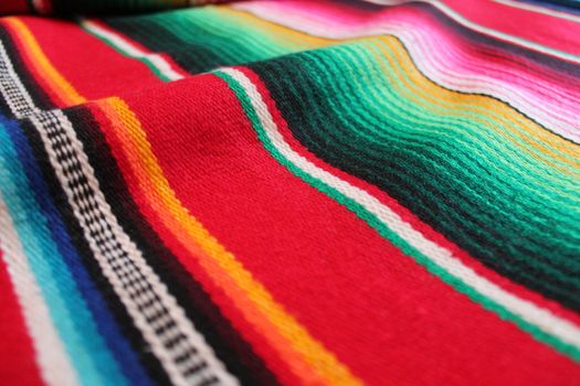 Mexico traditional cinco de mayo rug poncho fiesta background with stripes copy space