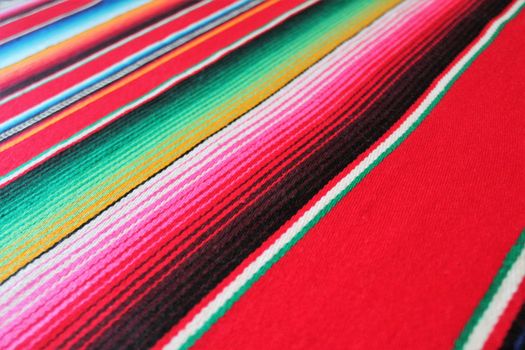 Mexico traditional cinco de mayo rug poncho fiesta background with stripes copy space