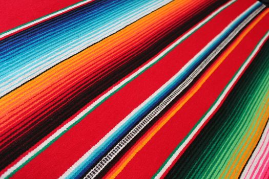 Mexico traditional cinco de mayo rug poncho fiesta background with stripes copy space