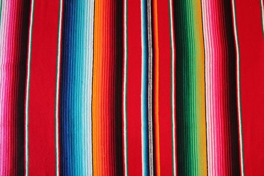 Mexico traditional cinco de mayo rug poncho fiesta background with stripes copy space