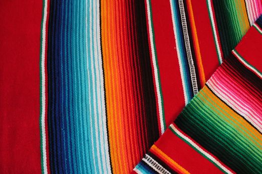 Mexico traditional cinco de mayo rug poncho fiesta background with stripes copy space