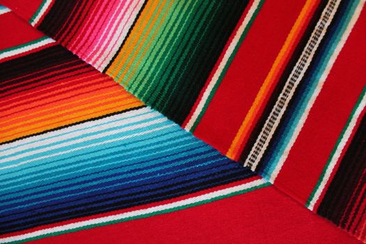 Mexico traditional cinco de mayo rug poncho fiesta background with stripes copy space