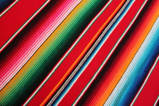 Mexico traditional cinco de mayo rug poncho fiesta background with stripes copy space