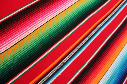 Mexico traditional cinco de mayo rug poncho fiesta background with stripes copy space