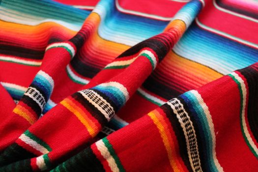 Mexico traditional cinco de mayo rug poncho fiesta background with stripes copy space