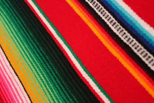 Mexico traditional cinco de mayo rug poncho fiesta background with stripes copy space