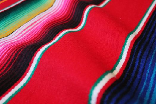 Mexico traditional cinco de mayo rug poncho fiesta background with stripes copy space