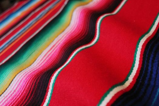 Mexico traditional cinco de mayo rug poncho fiesta background with stripes copy space