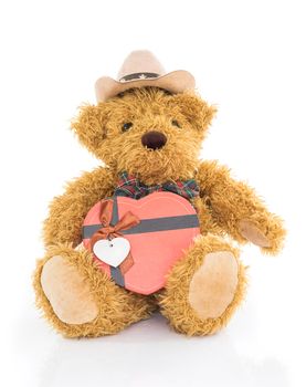 Teddy bear with 
Red heart shaped gift box on white background