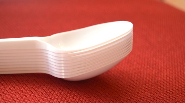 picture of a plastic disposable spoons,food concept