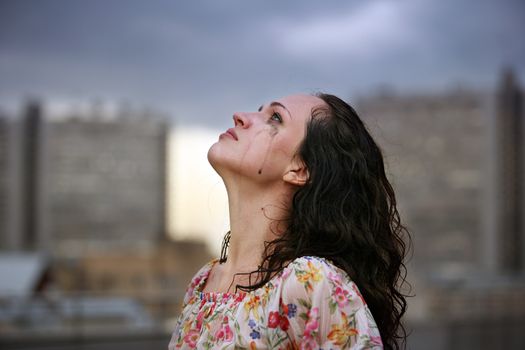 Portrait of a young crying brunette