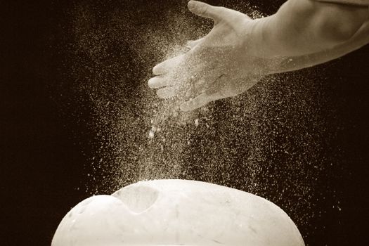 Close-up of hands of the gymnast in talc