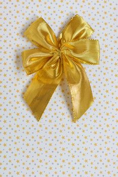 Gold ribbon with bow and stars