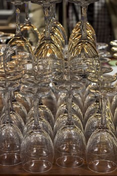 Empty glasses for wine sorted on a table in bar