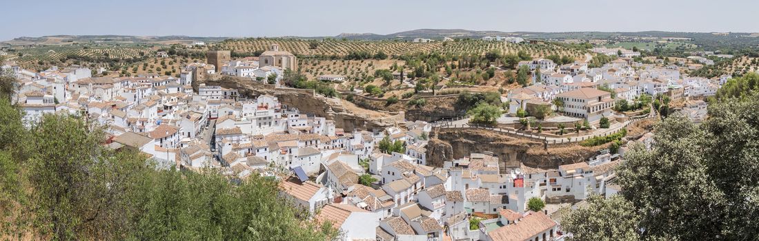 Panoramic view of Setenil de las Bodegas, Cadiz, Spain. Street with dwellings built into rock overhangs above Rio Trejo.