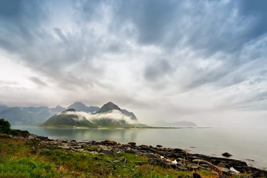 Norway lofoten islands in clouds of fog. Cloudy Nordic day.