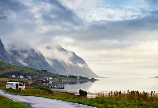 Norway villages in fjord on lofoten islands. Cloudy Nordic day.