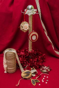 handmade Christmas decorations and toys on a red background