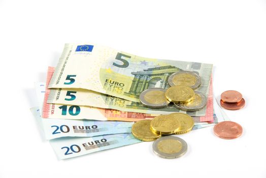 several types of banknotes and coins isolated on a white background                     