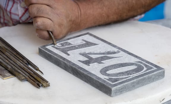 stonecutter making art from raw stone
