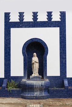 blue and white catholic monument with maria sculpture in moura alentejo Portugal