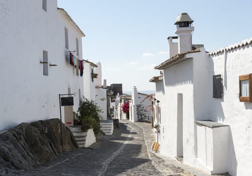 old mstreet with typical white houses in portugal alentejo village miradouro