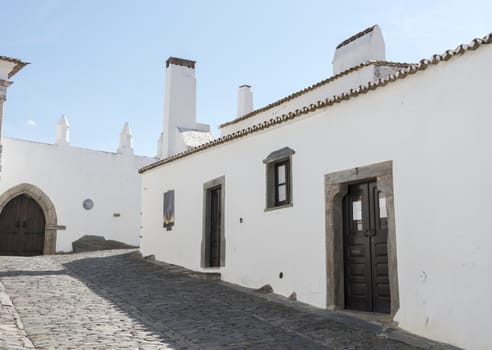 street with white houses monsaraz in alentejo portugal