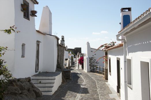 street with white houses monsaraz in alentejo portugal
