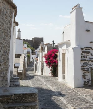 street with white houses monsaraz in alentejo portugal