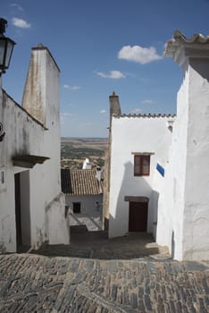 street with white houses monsaraz in alentejo portugal