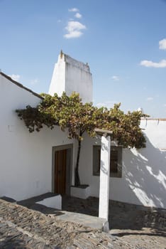 street with white houses monsaraz in alentejo portugal