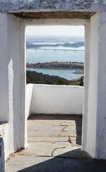 view form concrete window to the alquave bridge and nature landscape in alentejo Portugal near monsaraz