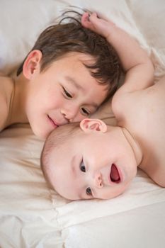 Young Mixed Race Chinese and Caucasian Baby Brothers Having Fun on Their Blanket.