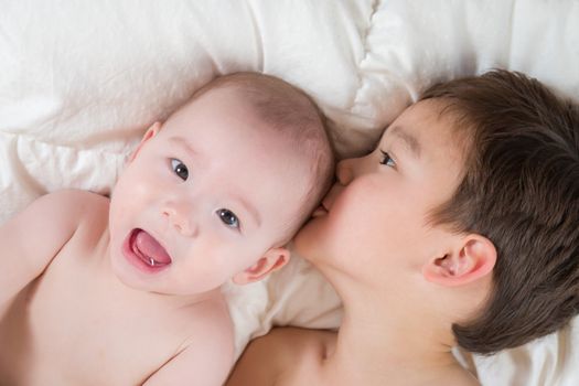 Young Mixed Race Chinese and Caucasian Baby Brothers Having Fun on Their Blanket.