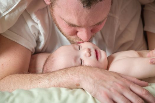 Mixed Race Chinese and Caucasian Baby Boy Laying In Bed with His Father and Mother.