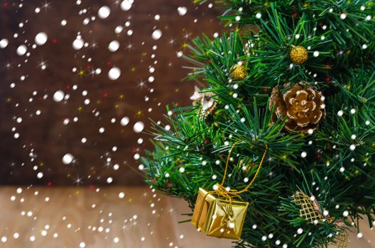 Christmas background with decorations and gift boxes on wooden board
