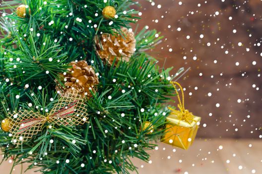 Christmas background with decorations and gift boxes on wooden board