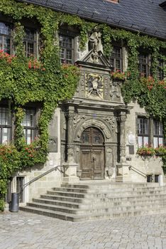 Townhalf of the old village of  Quedlinburg with flowers and old staircase