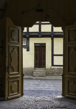 very old wooden hadncraft door half timbered in quedlinburg germany