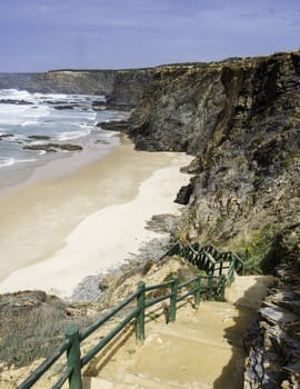 the brown golden rocks of alentejo with the atlantic ocean and beach of potugal