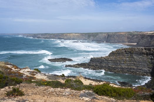 wild ocean splash water to the rocks of the west coast of Portugal