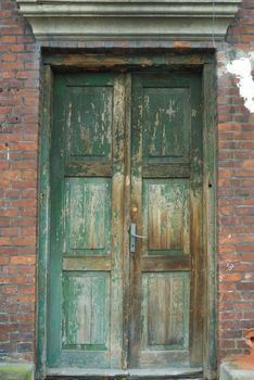 very old antique colored door of the building