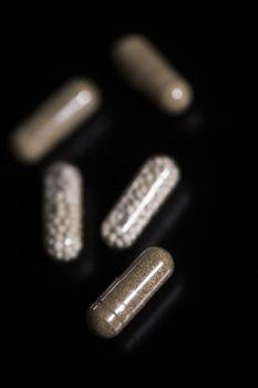 Fiber natural pills, phytotherapie on black background
