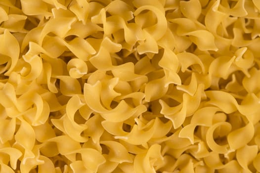 Full background of dry uncooked pasta, Food